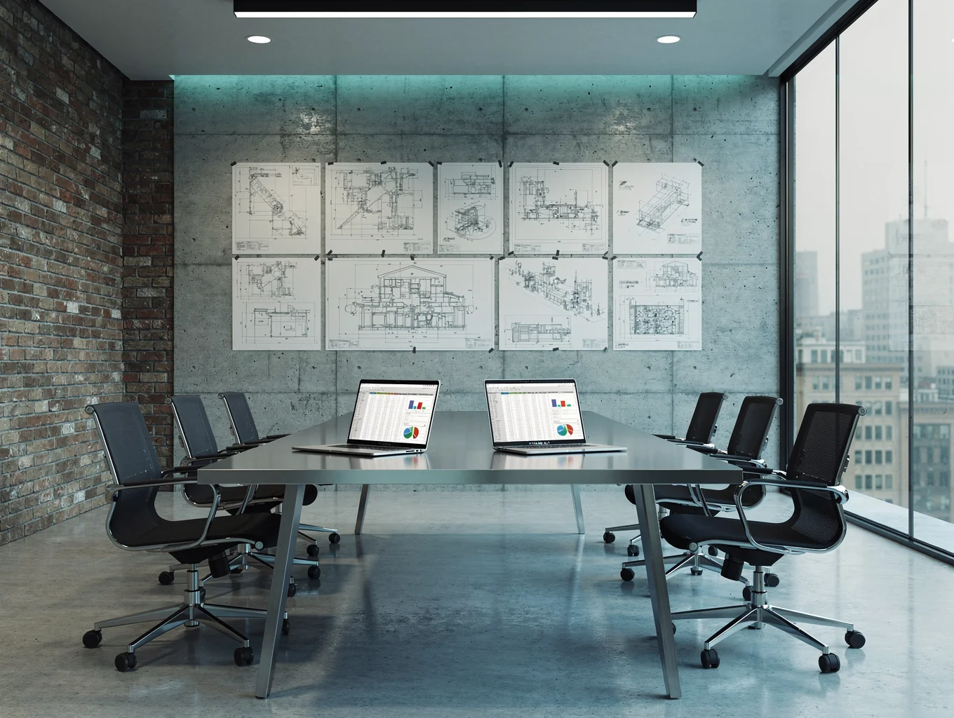 Recruitment consultants in an open-plan engineering consultancy office reviewing project documentation